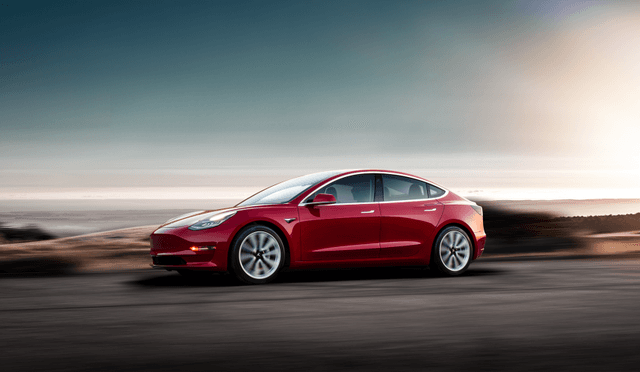 Tesla model 3 red side view